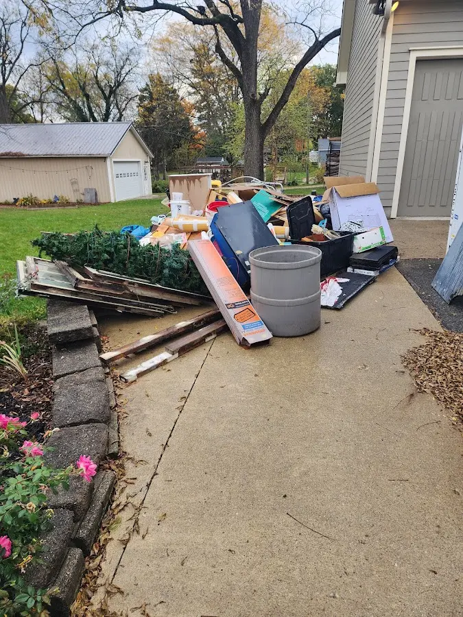 Dumpster being loaded with debris for 3 Yard Dumpster Rental in Boonsboro